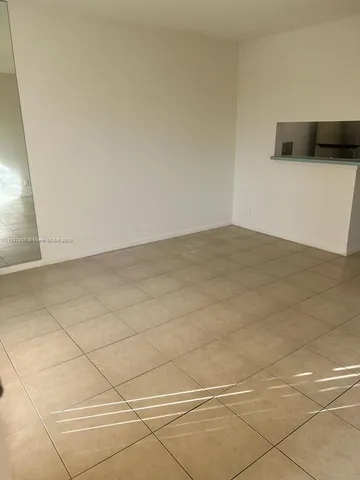 a kitchen with stainless steel appliances a stove a microwave and a sink