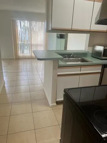 a white toilet sitting next to a bath tub