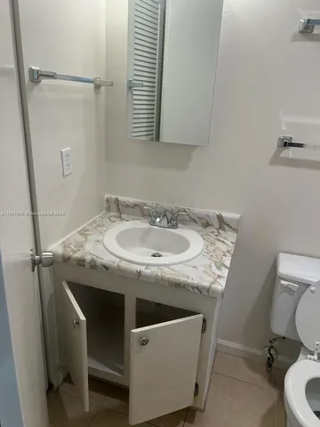 a bathroom with a toilet and a sink