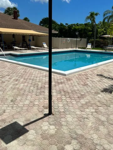 a view of a yard and front a house
