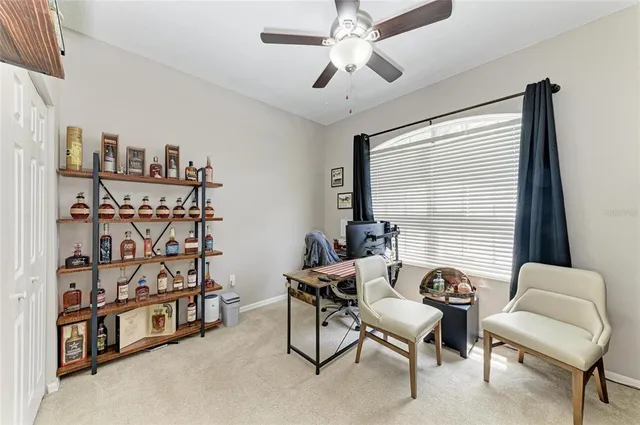 a bedroom with furniture and a flat screen tv