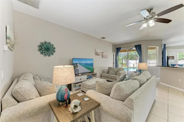 a living room with furniture and a large window