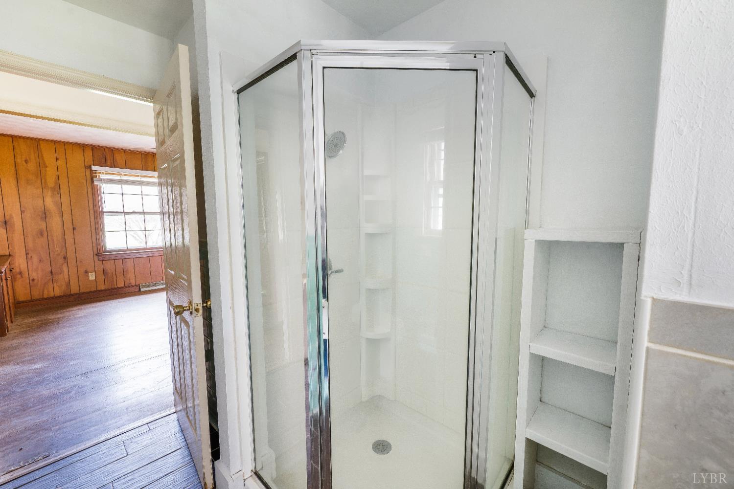 733 Oakville Road Appomattox, VA 24522 - Photo 11 of 52 a bathroom with a glass shower door