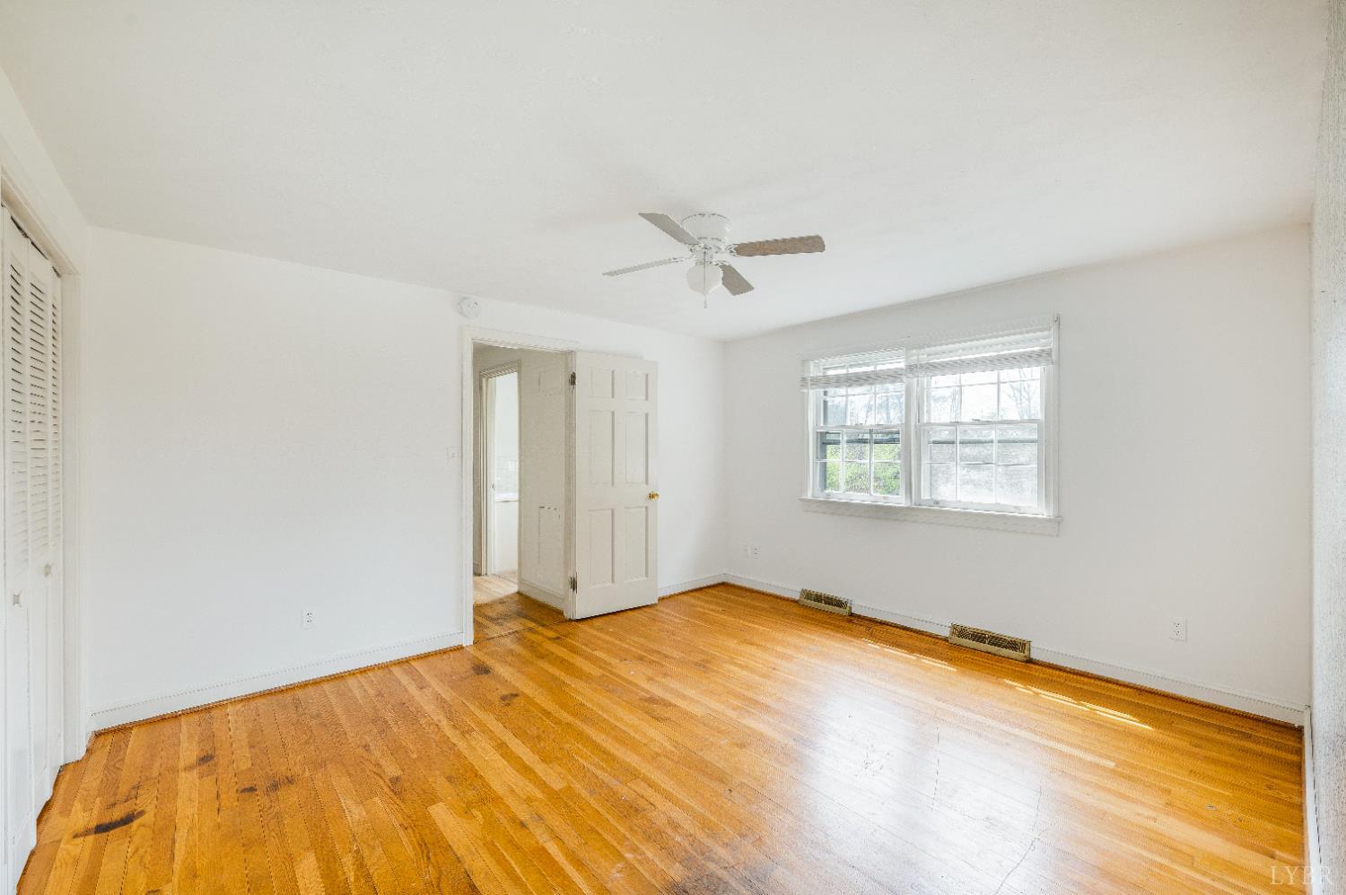 733 Oakville Road Appomattox, VA 24522 - Photo 12 of 52 a bedroom with a bed and a window