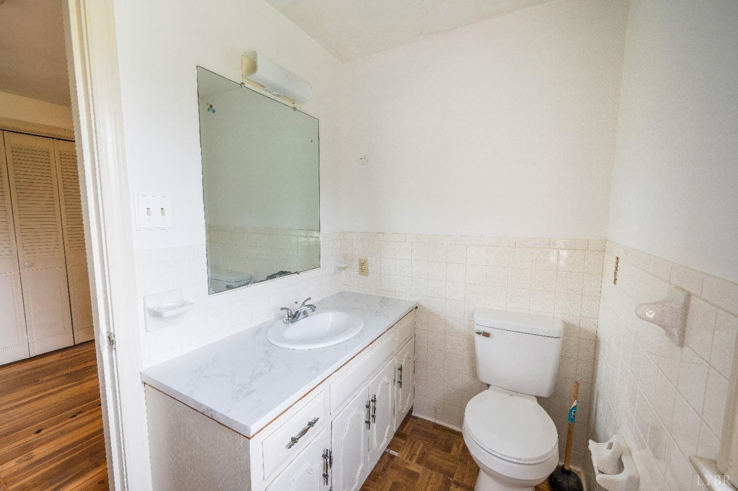 733 Oakville Road Appomattox, VA 24522 - Photo 14 of 52 a bathroom with a sink toilet and shower