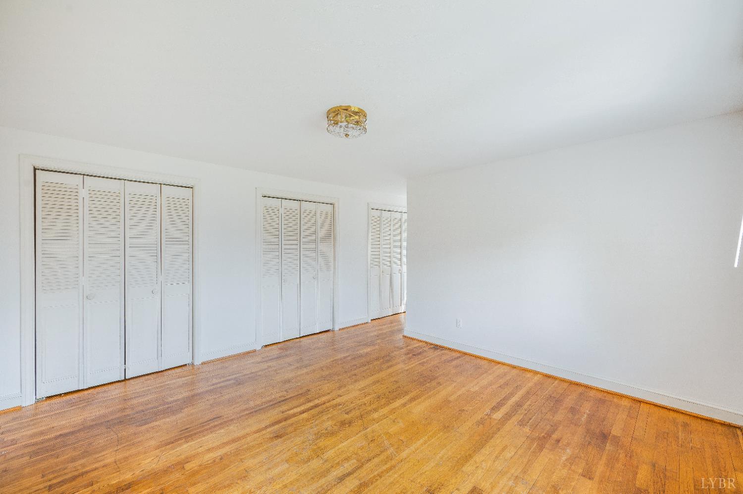 733 Oakville Road Appomattox, VA 24522 - Photo 16 of 52 a view of empty room with wooden floor