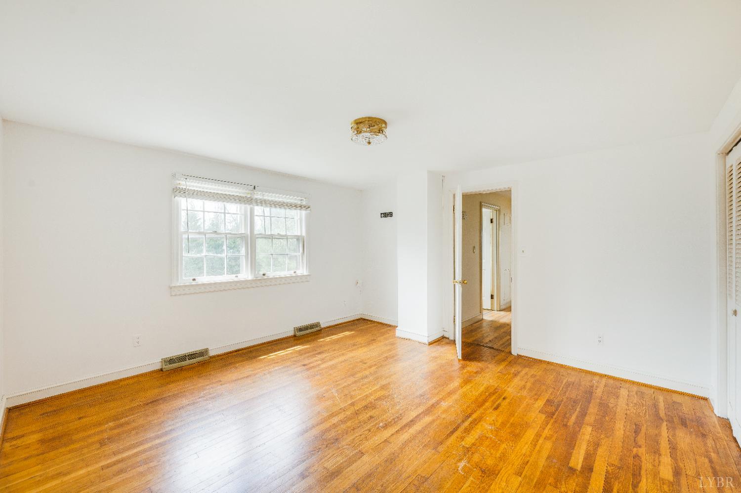 733 Oakville Road Appomattox, VA 24522 - Photo 18 of 52 a view of empty room with wooden floor and fan