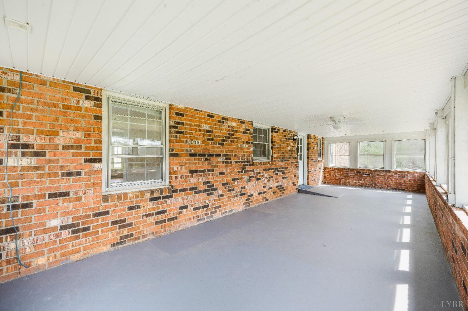 733 Oakville Road Appomattox, VA 24522 - Photo 3 of 52 a view of an empty room with a fireplace
