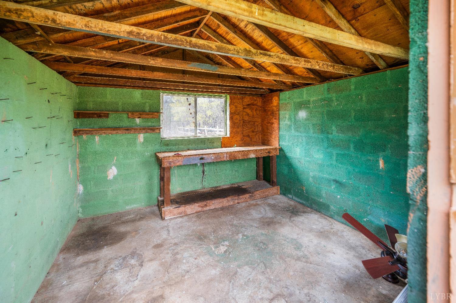 733 Oakville Road Appomattox, VA 24522 - Photo 41 of 52 a yellow room with a backyard