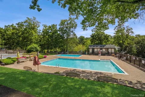 a view of a swimming pool with a yard