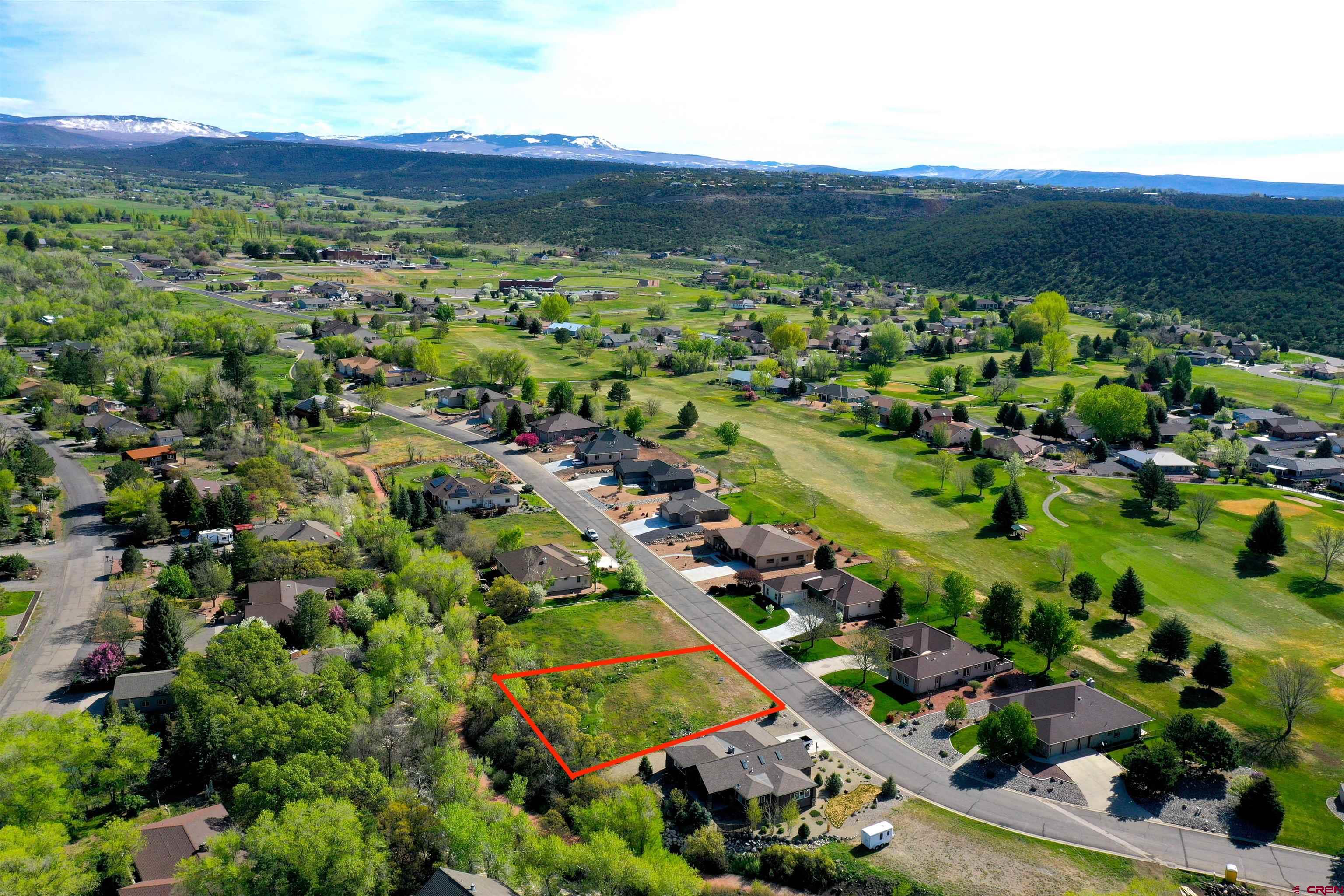 1440 Southeast Stonebridge Drive Cedaredge, CO 81413 - Photo 1 of 8 a view of a city with mountains in the background