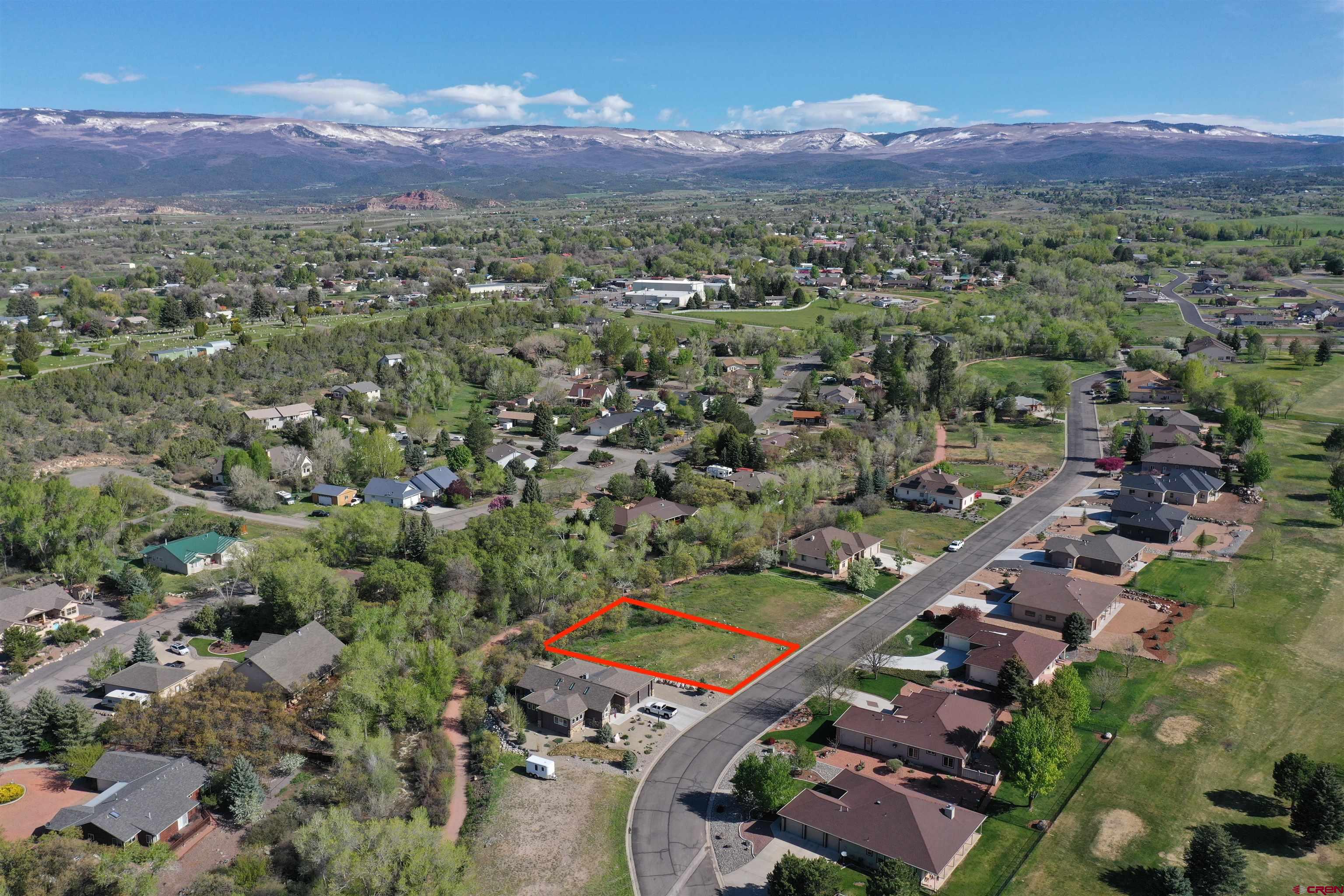 1440 Southeast Stonebridge Drive Cedaredge, CO 81413 - Photo 3 of 8 an aerial view of a house with a mountain