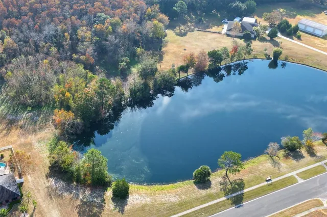 a view of a pond with sitting area
