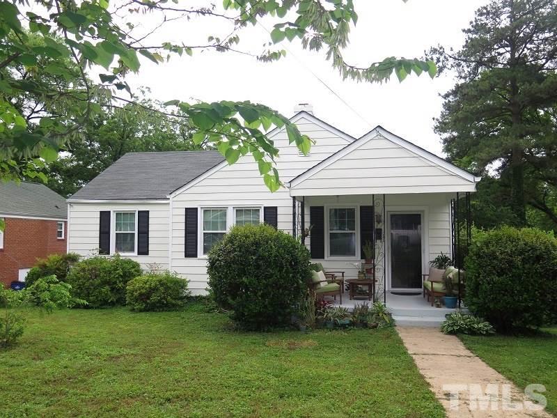 1202 Clifton Street Raleigh, NC 27604 - Photo 1 of 14 a front view of a house with a garden