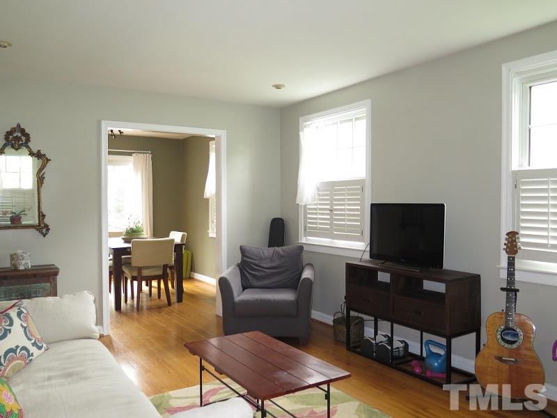 1202 Clifton Street Raleigh, NC 27604 - Photo 3 of 14 a living room with furniture and a flat screen tv
