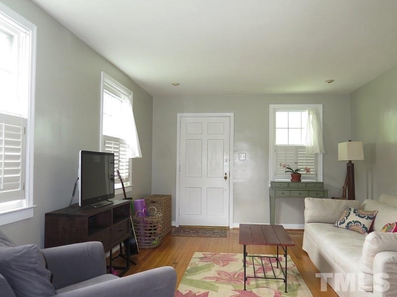 1202 Clifton Street Raleigh, NC 27604 - Photo 4 of 14 a living room with furniture and a flat screen tv