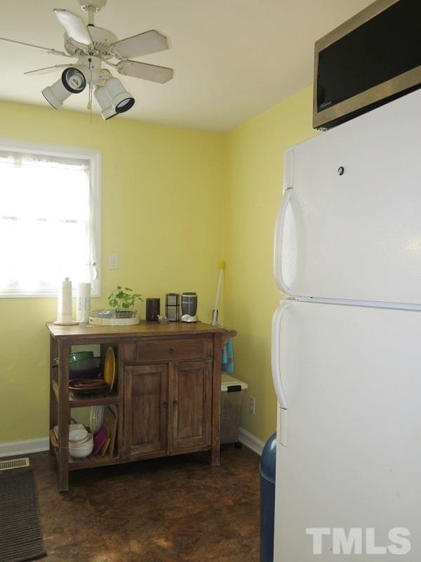 1202 Clifton Street Raleigh, NC 27604 - Photo 7 of 14 a room with a bed and furniture