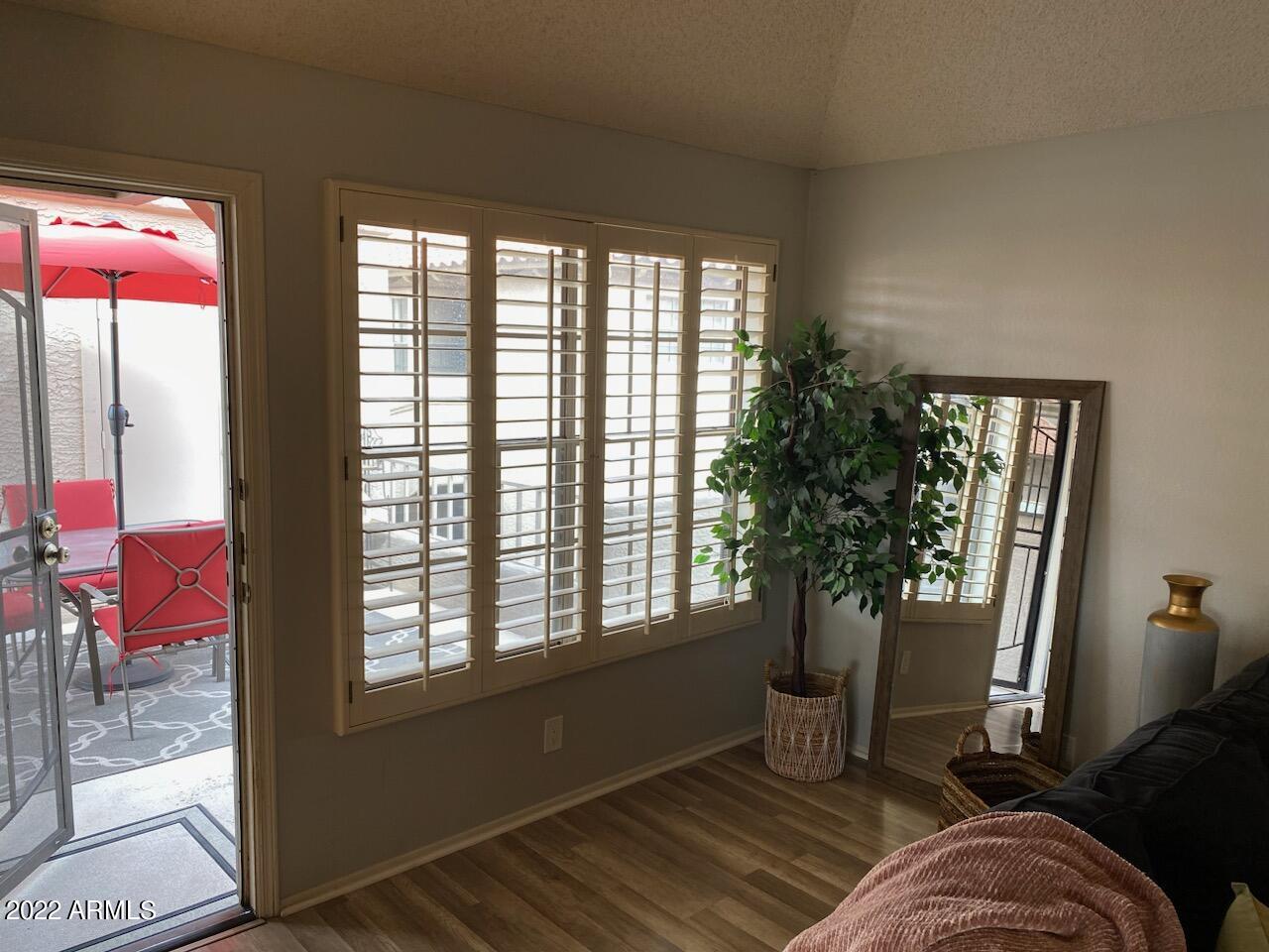 10017 East Mountain View Road, Unit 2058 Scottsdale, AZ 85258 - Photo 14 of 37 a living room with furniture and a window