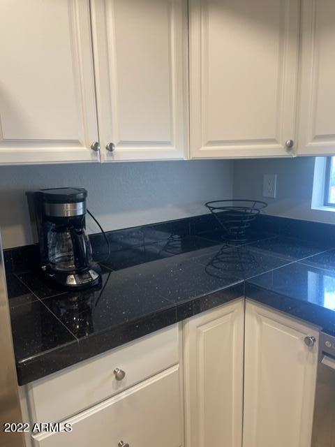 10017 East Mountain View Road, Unit 2058 Scottsdale, AZ 85258 - Photo 22 of 37 a kitchen with a sink and cabinets