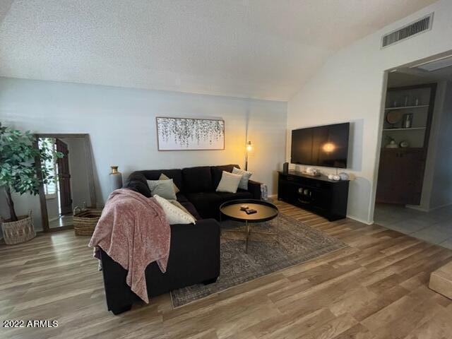 10017 East Mountain View Road, Unit 2058 Scottsdale, AZ 85258 - Photo 24 of 37 a living room with furniture and a flat screen tv