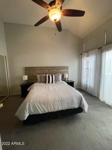 10017 East Mountain View Road, Unit 2058 Scottsdale, AZ 85258 - Photo 28 of 37 a bedroom with a bed and a ceiling fan