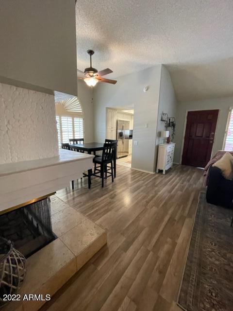 10017 East Mountain View Road, Unit 2058 Scottsdale, AZ 85258 - Photo 36 of 37 a living room with furniture and wooden floors