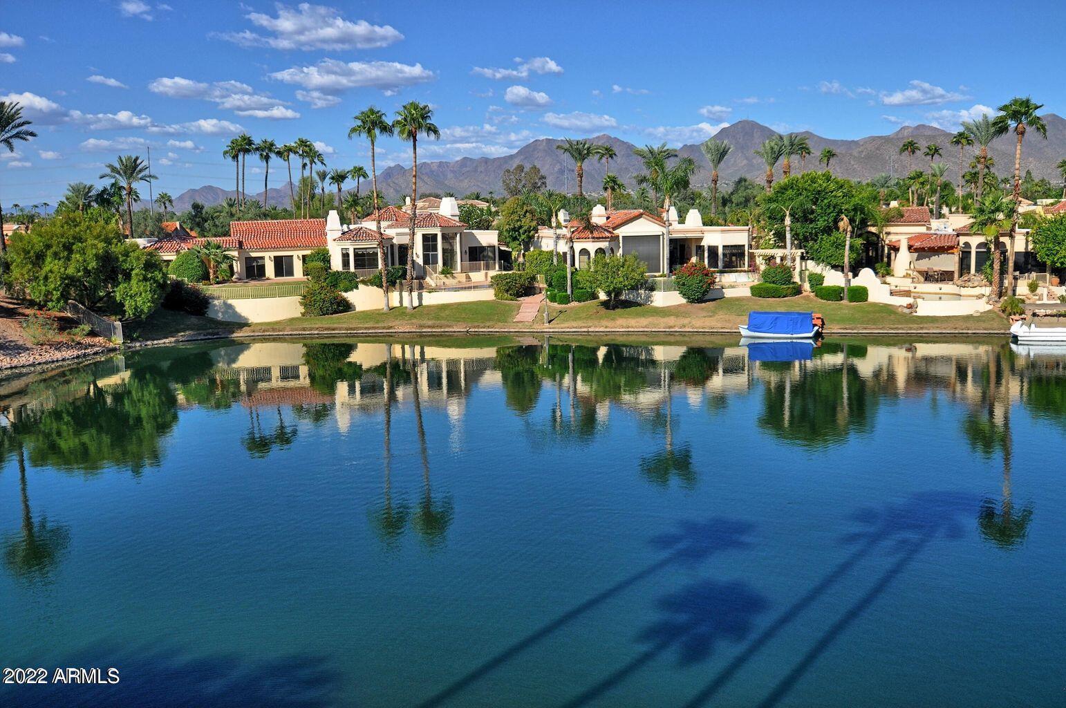 10017 East Mountain View Road, Unit 2058 Scottsdale, AZ 85258 - Photo 37 of 37 a view of a lake with a house swimming pool and outdoor space
