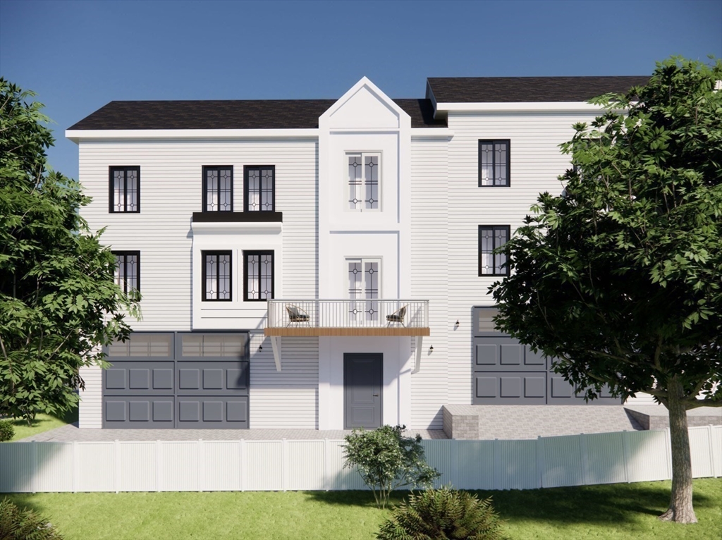 26 Maxwell Street Worcester, MA 01607 - Photo 2 of 6 a front view of a house with a yard and garage