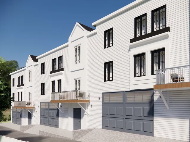 a front view of a house with a garage