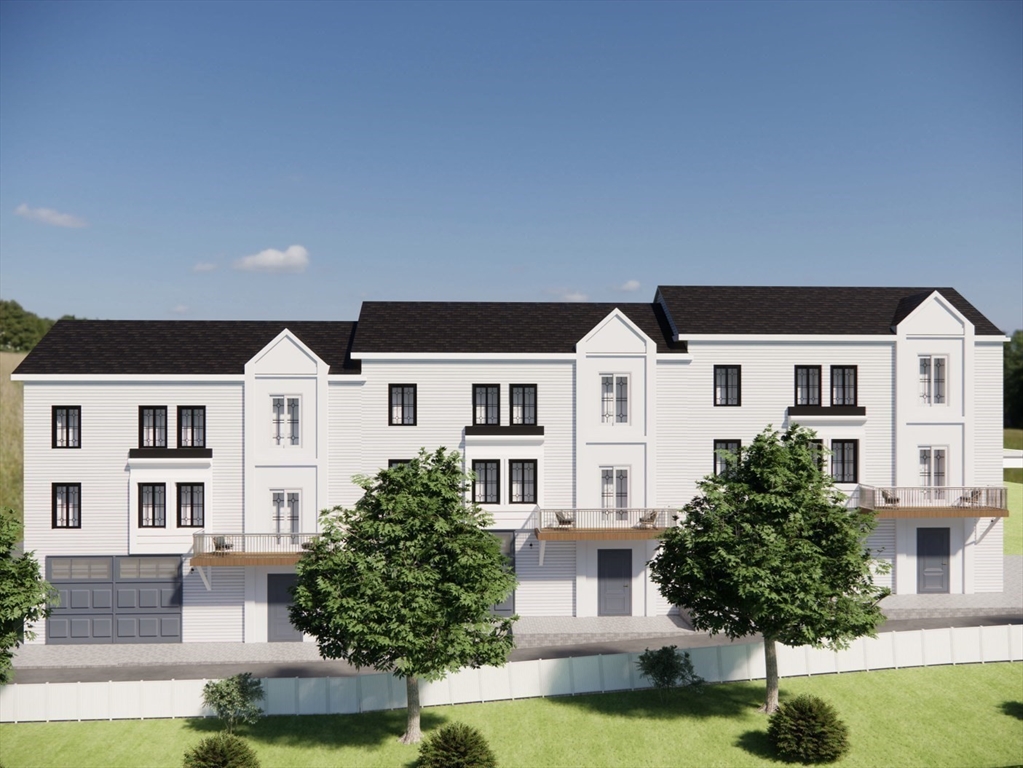 26 Maxwell Street Worcester, MA 01607 - Photo 5 of 6 a front view of a house with yard and garage