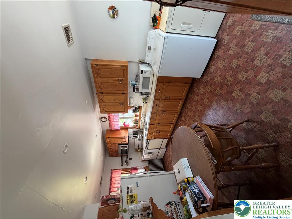 1340 Cowpath Road Hatfield, PA 19440 - Photo 7 of 16 a room with a kitchen island a sink wooden floor and appliances