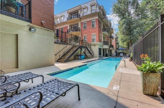 560 Dutch Valley Road Northeast, Unit 2413 Atlanta, GA 30324 - Photo 1 of 11 a view of a backyard with a patio