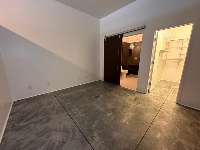 560 Dutch Valley Road Northeast, Unit 2413 Atlanta, GA 30324 - Photo 4 of 11 an empty room with windows