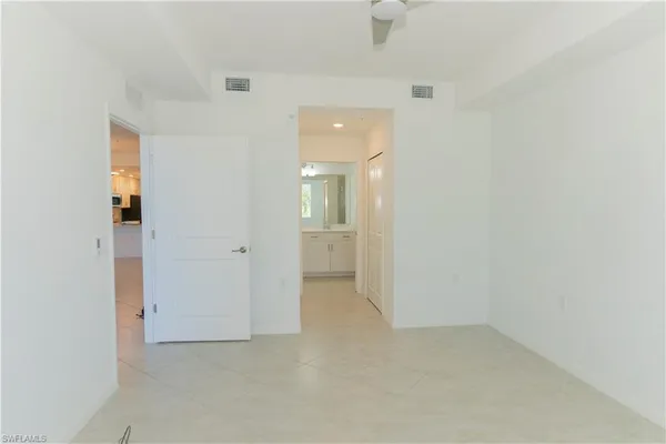 an empty room with a bathroom