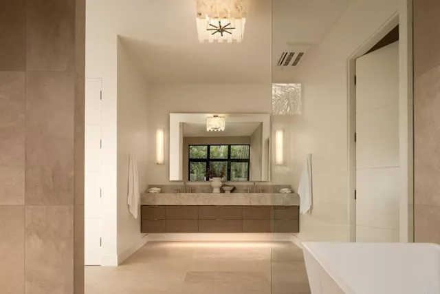 a en suite bathroom with a sink and a mirror