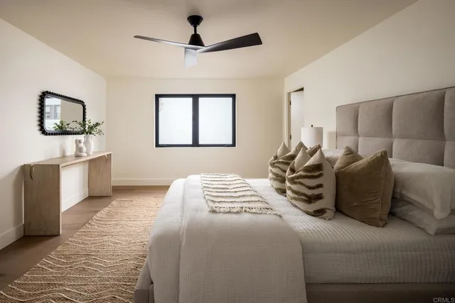 a bedroom with a large bed and a couch