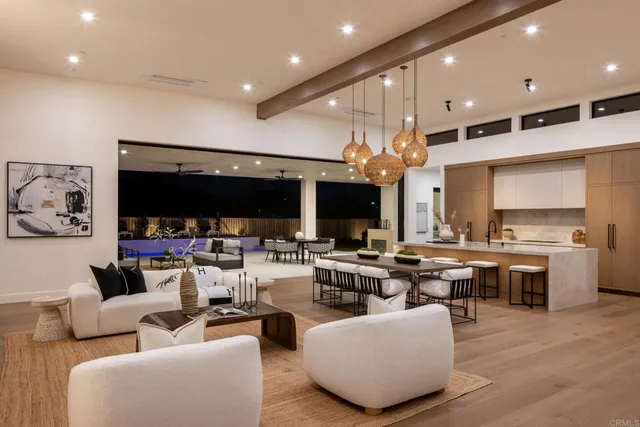 a living room with fireplace furniture and a flat screen tv