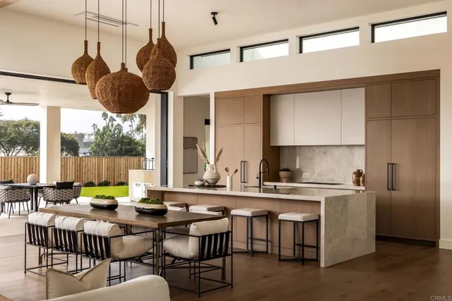 a kitchen with a table chairs stove and cabinets