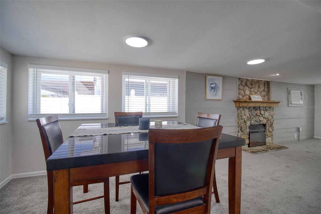 6820 Sea Ranch Drive Hudson, FL 34667 - Photo 10 of 29 a dining room with furniture and window