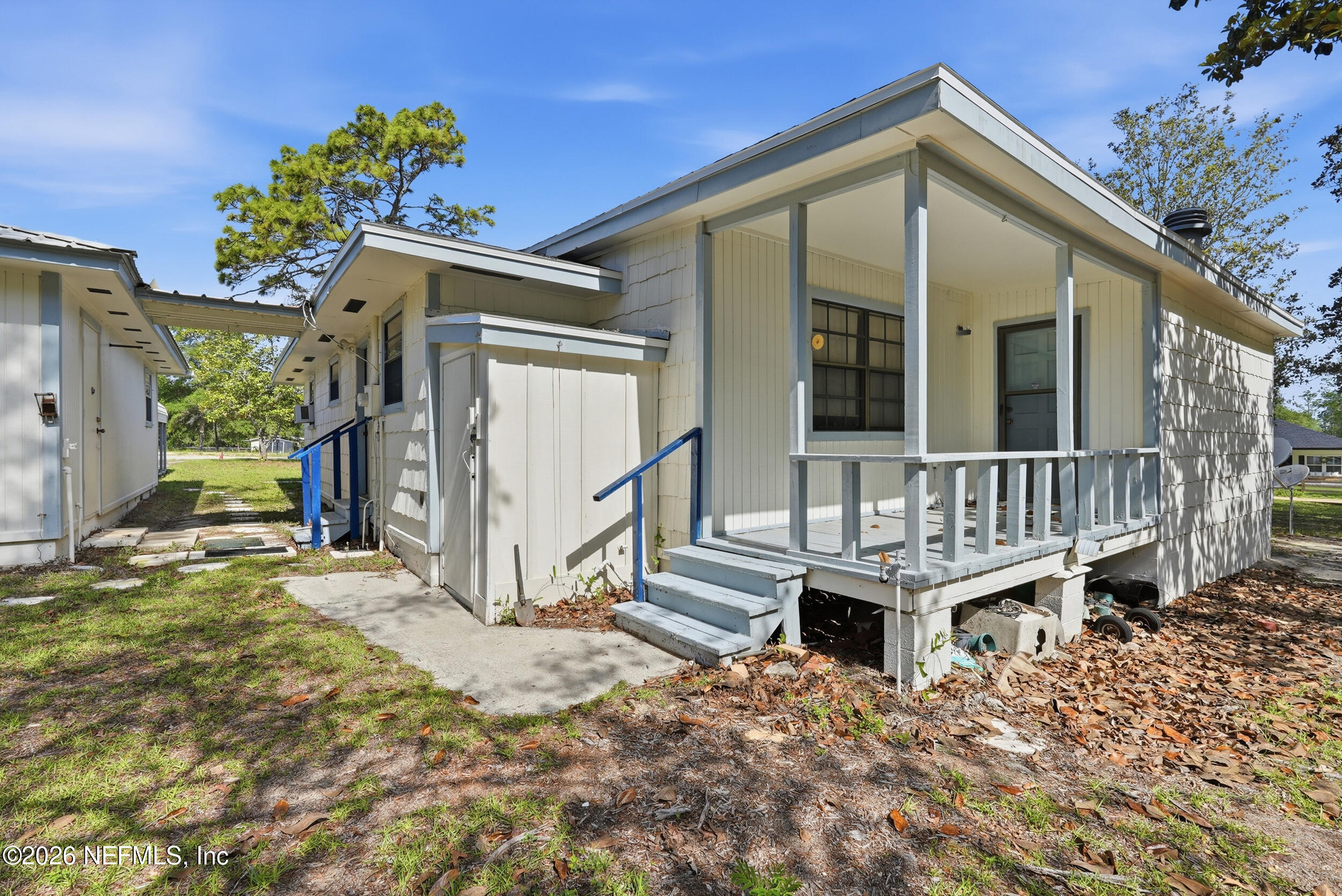 7593 Silver Sands Road Keystone Heights, FL 32656 - Photo 26 of 36 a view of house with a small yard and wooden fence