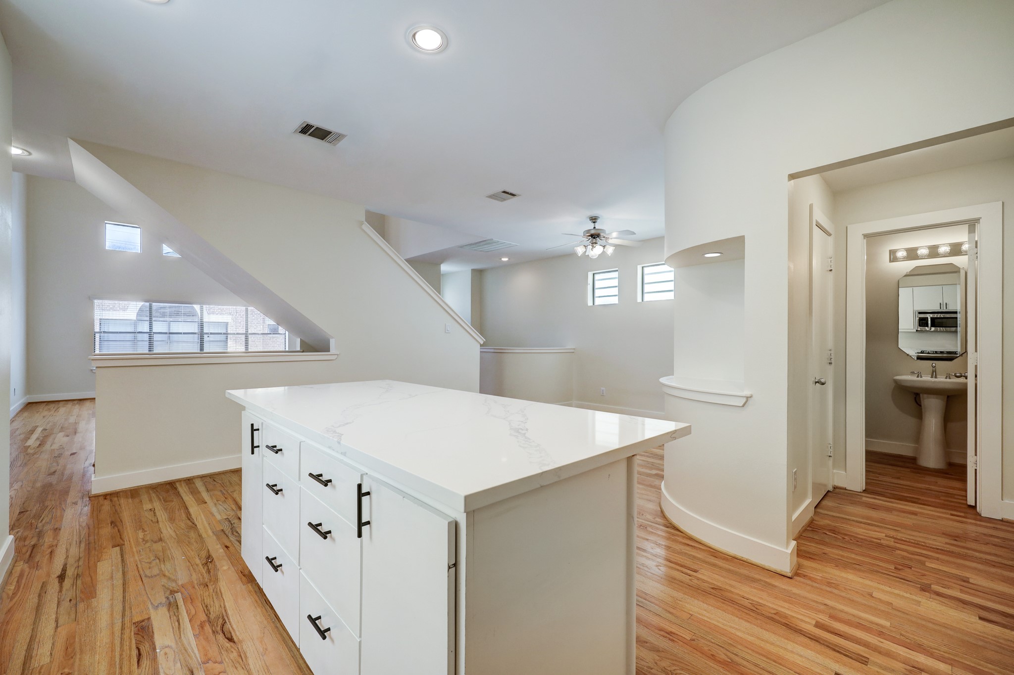 2705 Rutland Street, Unit B Houston, TX 77008 - Photo 5 of 21 Alternate view of the Kitchen showing the expansive openness of the home. From this angle you can see the Powder Room tucked away on the right, Living Room on the Left & the Dining Room straight ahead!