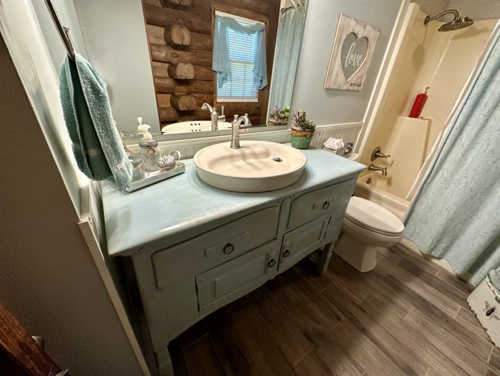 188 Link Road Cottontown, TN 37048 - Photo 14 of 45 a bathroom with a sink a toilet a mirror and vanity