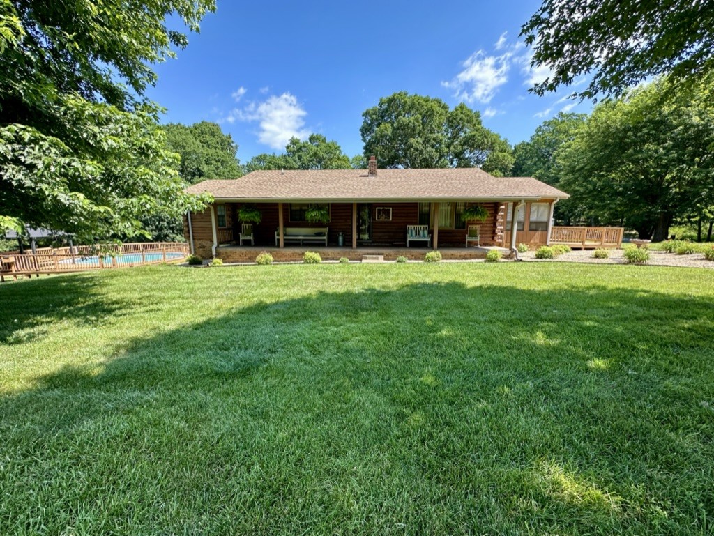 188 Link Road Cottontown, TN 37048 - Photo 2 of 45 a front view of a house with a garden