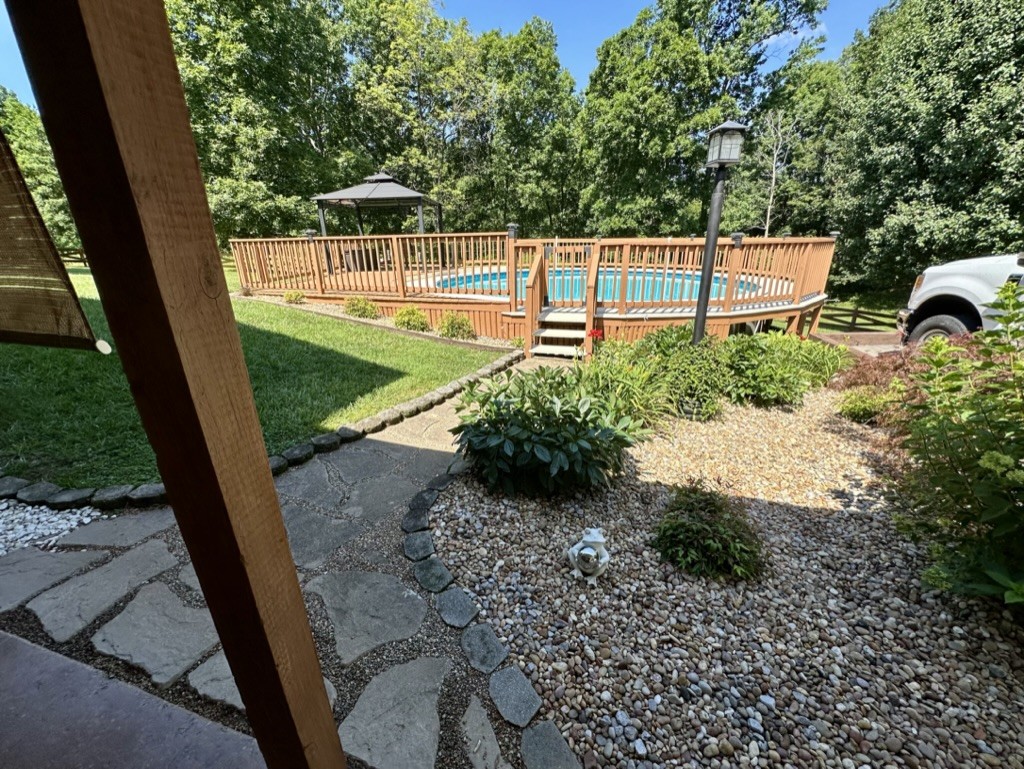 188 Link Road Cottontown, TN 37048 - Photo 22 of 45 a view of a backyard with a garden