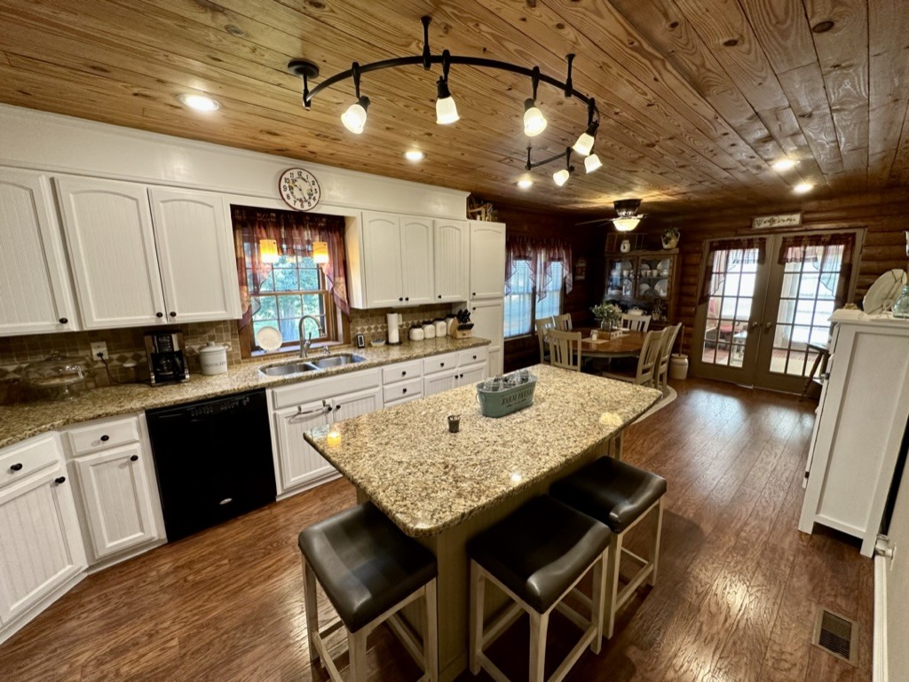 188 Link Road Cottontown, TN 37048 - Photo 5 of 45 a kitchen with stainless steel appliances granite countertop a sink a stove counter space and wooden floor