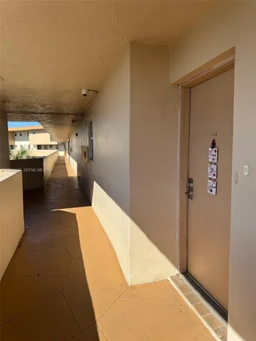 a hallway with storage and utility