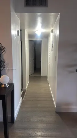 a view of hallway with shower