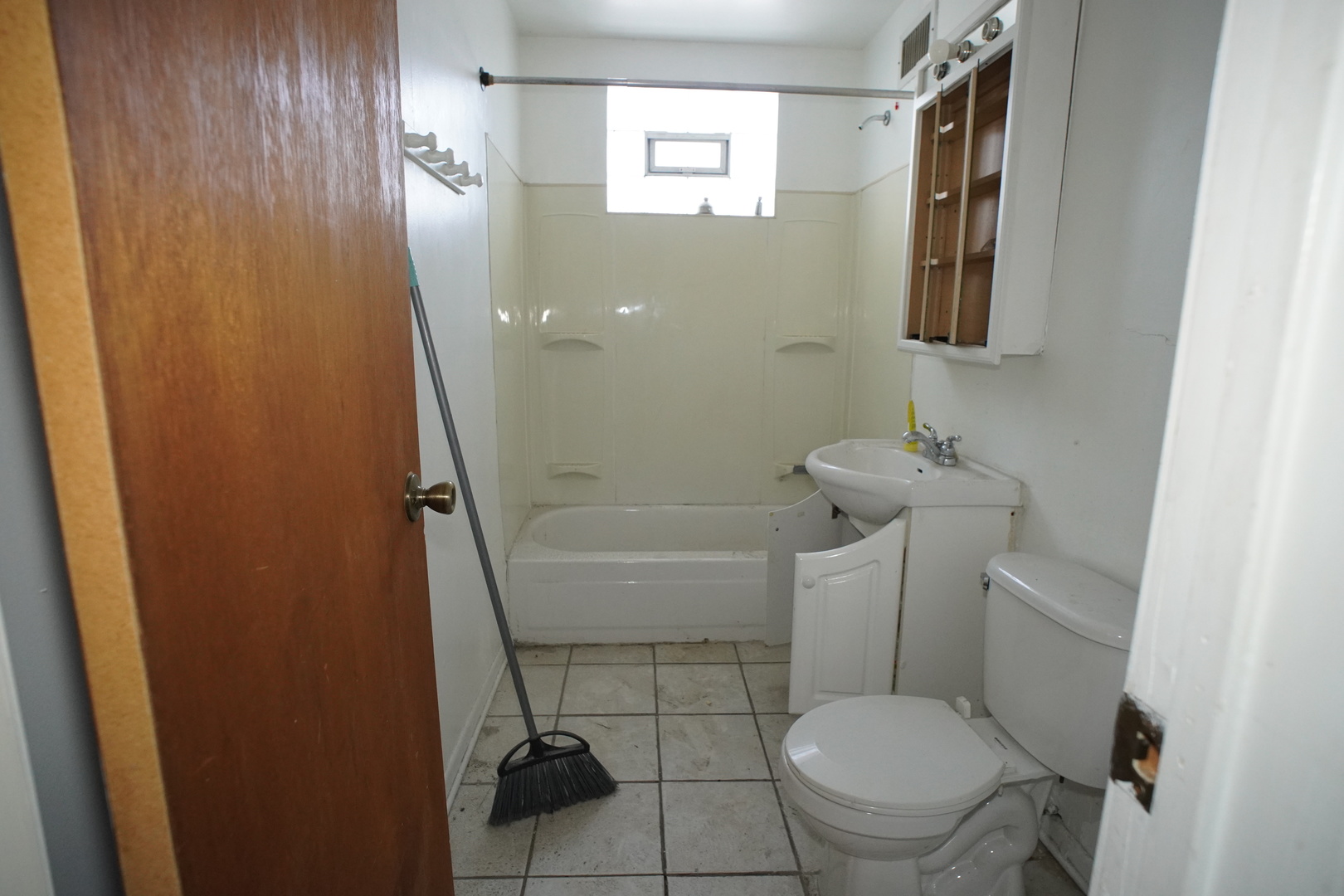 5425 Melton Road Gary, IN 46403 - Photo 8 of 31 a bathroom with a toilet and a shower