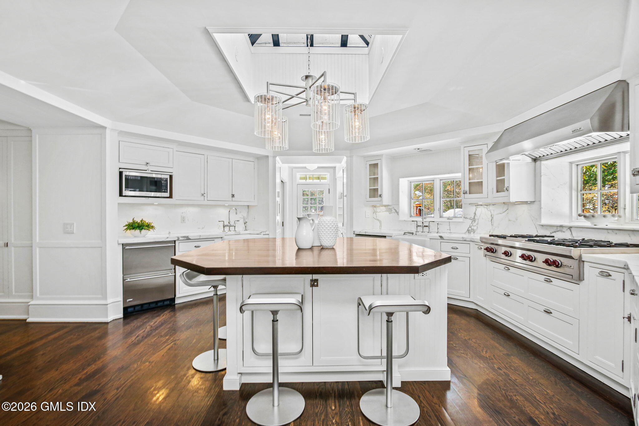 164 Round Hill Road Greenwich, CT 06831 - Photo 16 of 67 a dining table with chairs and wooden floor