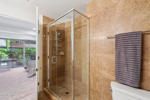 a bathroom with a shower and a sink